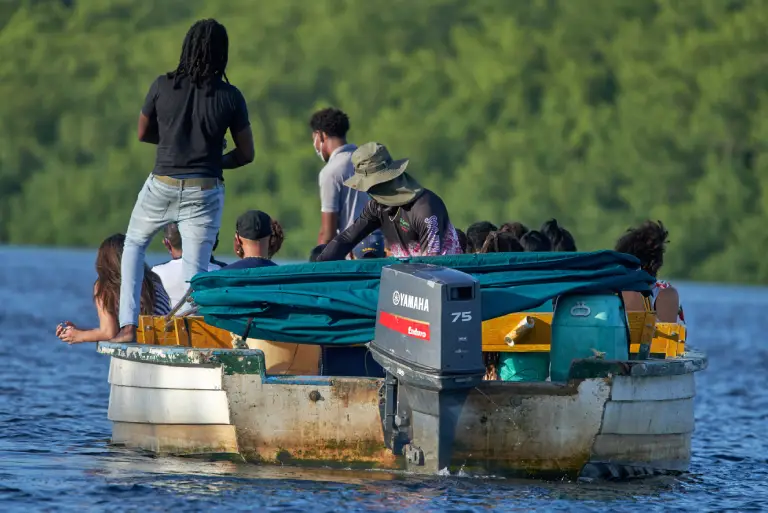 group on small boat representing Montana vehicle registration for recreational and utility watercraft