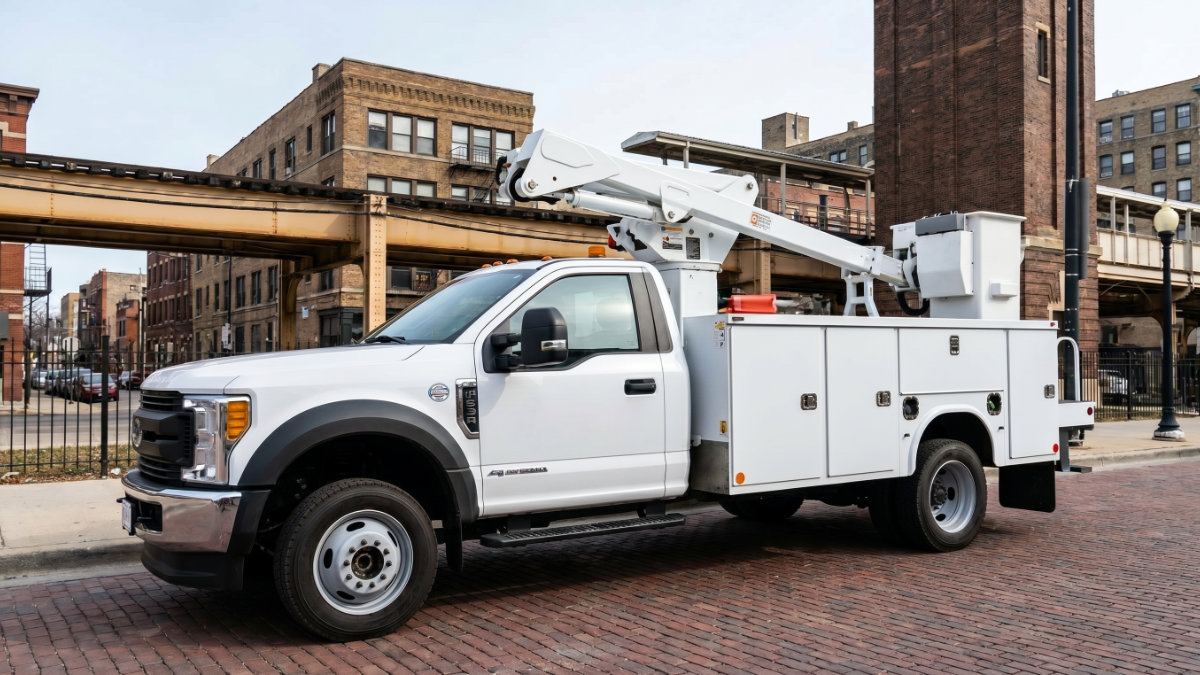 A white heavy-duty service truck parked in an urban area, requiring streamlined registration and title management for operational velocity.